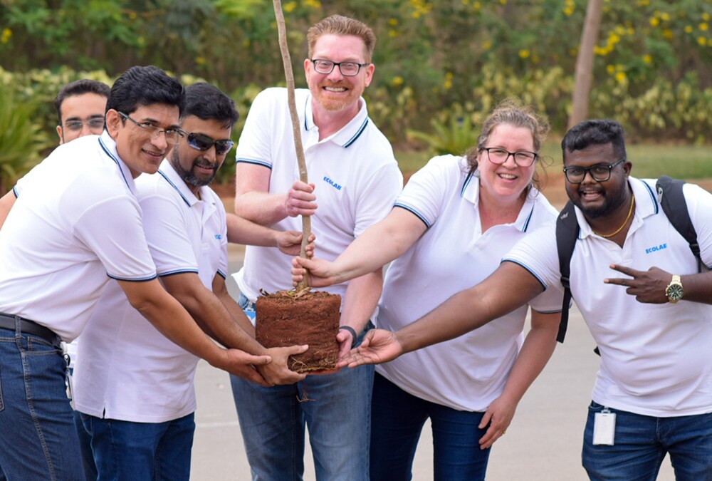 Ecolab employees planting a tree