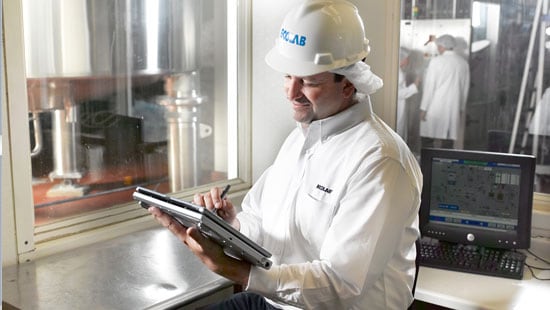 Ecolab Engineering Expert Inspecting at a Beverage Processing Plant 