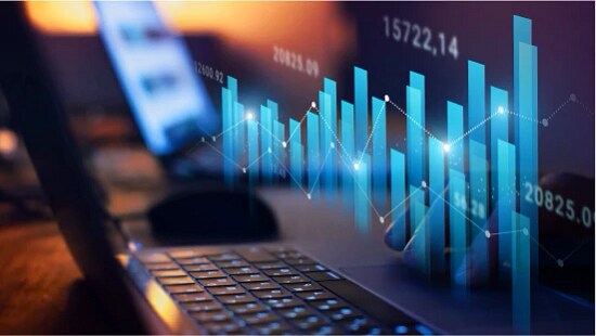 graph over a laptop with digital overlay