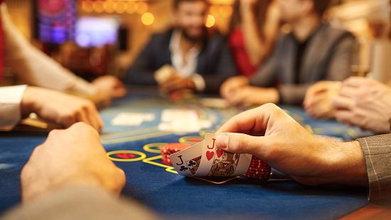 people playing poker in a casino